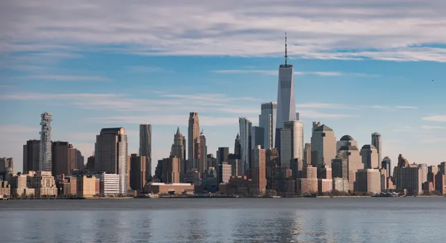 Lower Manhattan skyline and One World Trade Center viewed across the water.